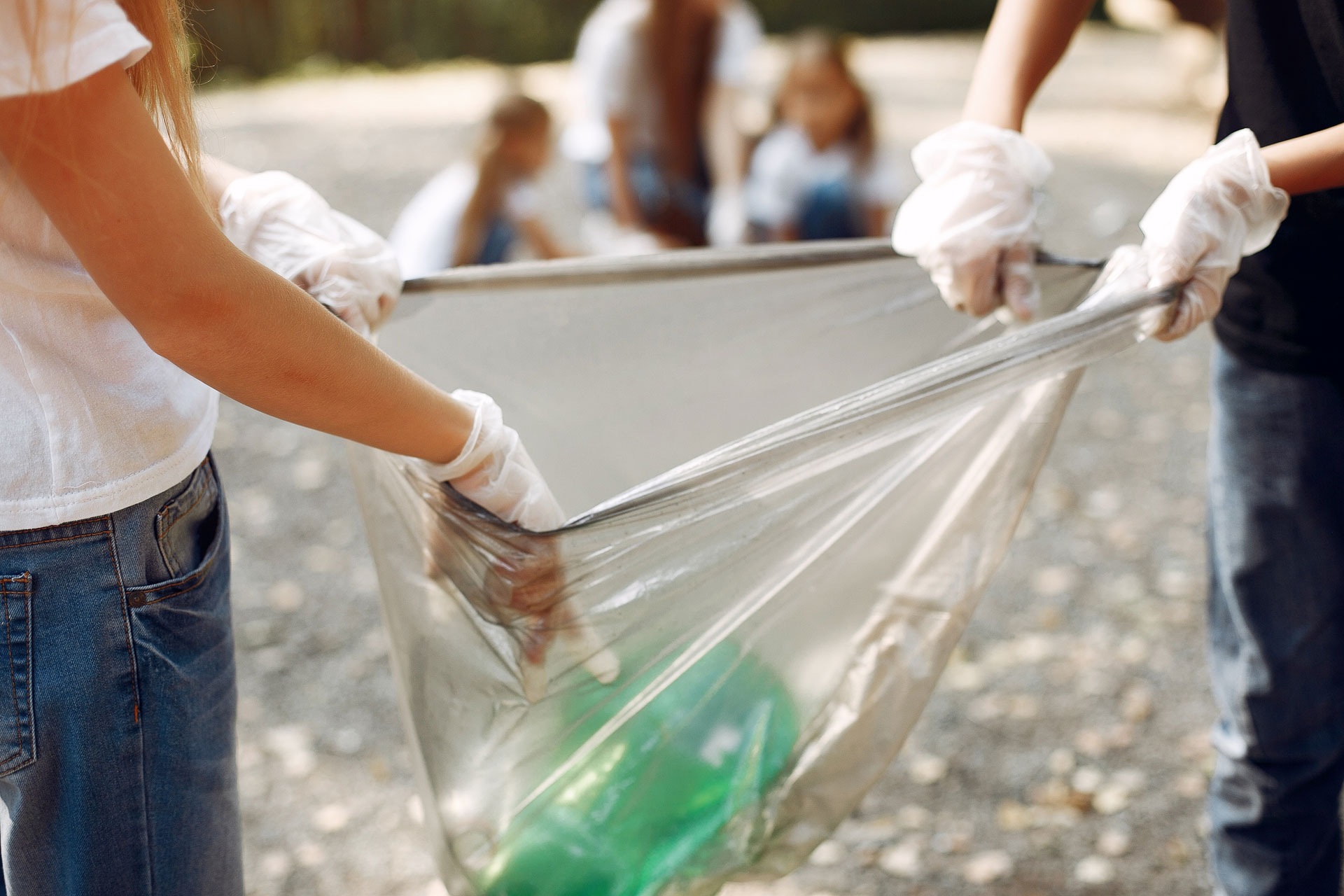 children-collects-garbage-in-garbage-bags-in-park-Q5VGGXP.jpg
